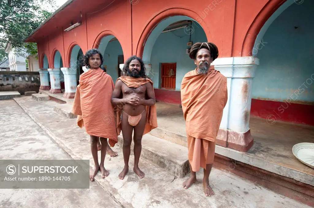 Barefoot Joranda monks wearing orange cloths in a monastery building, Joranda, Orissa, India, Asia