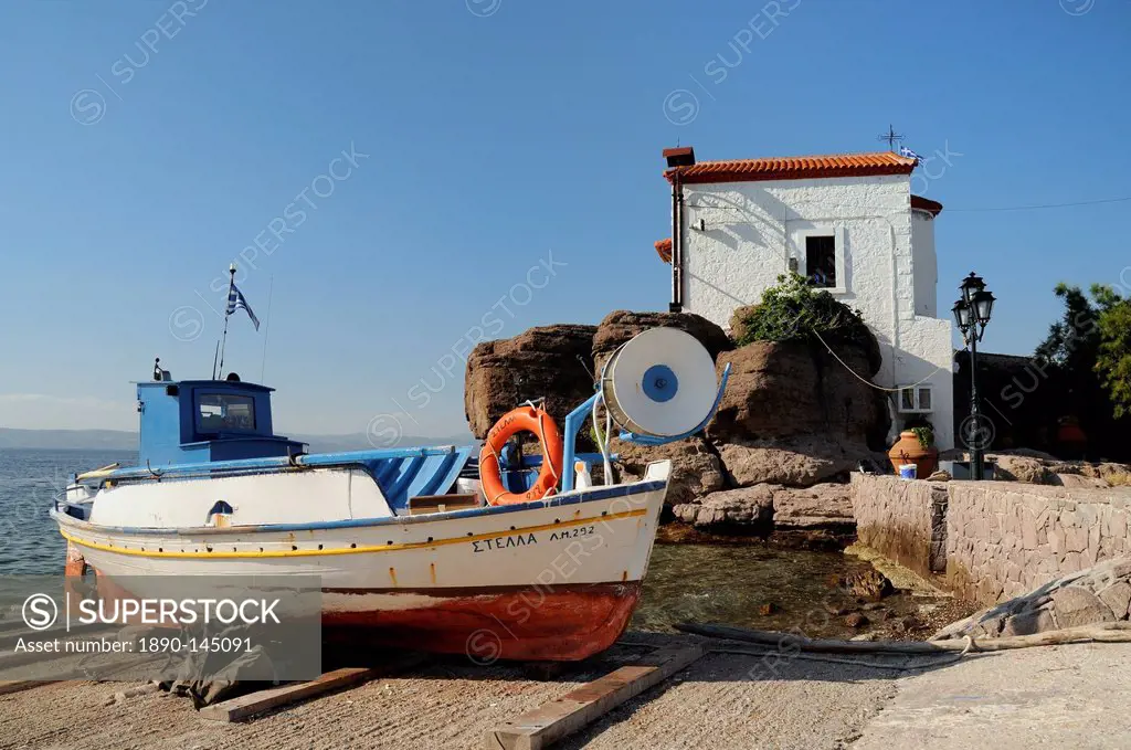 Fishing boat Stella on ramp near small chapel at Skala Sikaminia, Lesbos Lesvos, Greek Islands, Greece, Europe