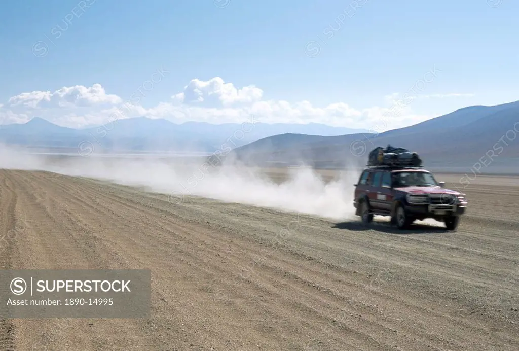 Land cruiser on altiplano track with tourists going to Laguna Colorado, Southwest Highlands, Bolivia, South America