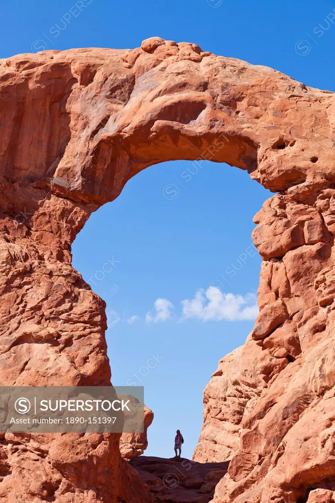 Lone hiker in Turret Arch, Arches National Park, near Moab, Utah, United States of America, North America