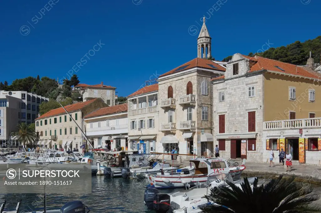 Promenade cafes by the old harbour in the medieval city of Hvar, on the island of Hvar, Dalmatia, Croatia, Europe