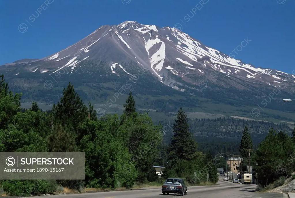 Mount Shasta, a dormant volcano with glaciers, 14161 ft high, with town of Weed in foreground, California, United States of America, North America