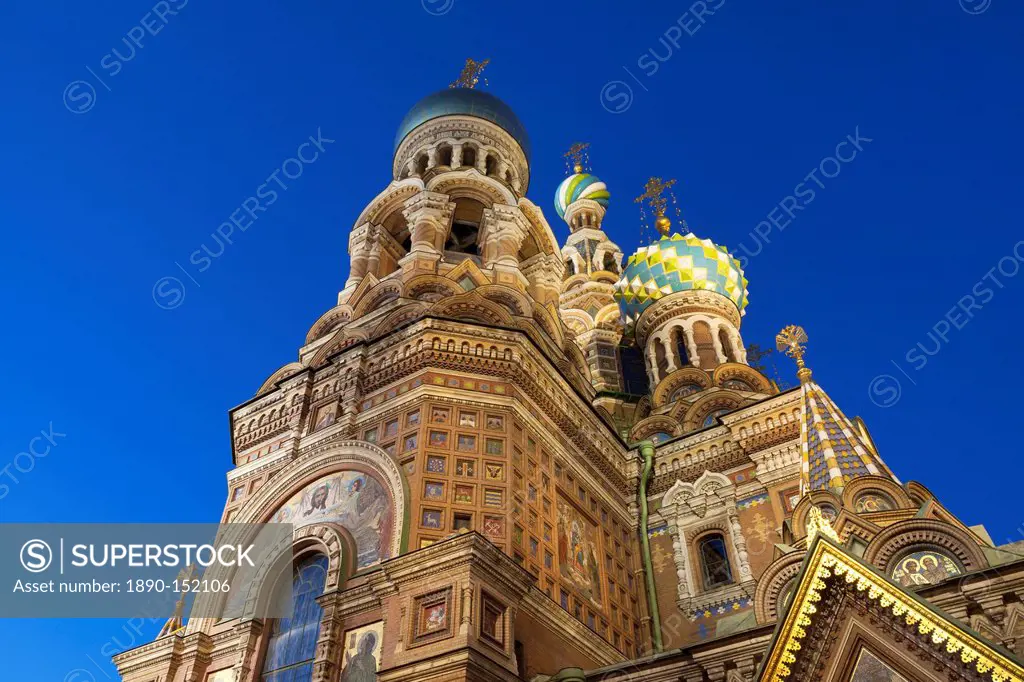 Looking up at the Church on Spilled Blood illuminated at dusk, UNESCO World Heritage Site, St. Petersburg, Russia, Europe