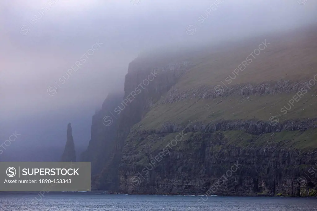 Towering cliffs and sea stacks on the west coast of Sandoy, Faroe Islands, Denmark, Europe