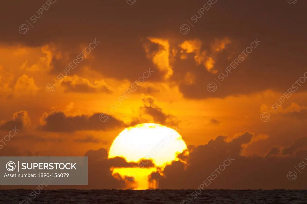 Sun rising out of the sea, Palm Cove, Cairns, North Queensland, Australia, Pacific