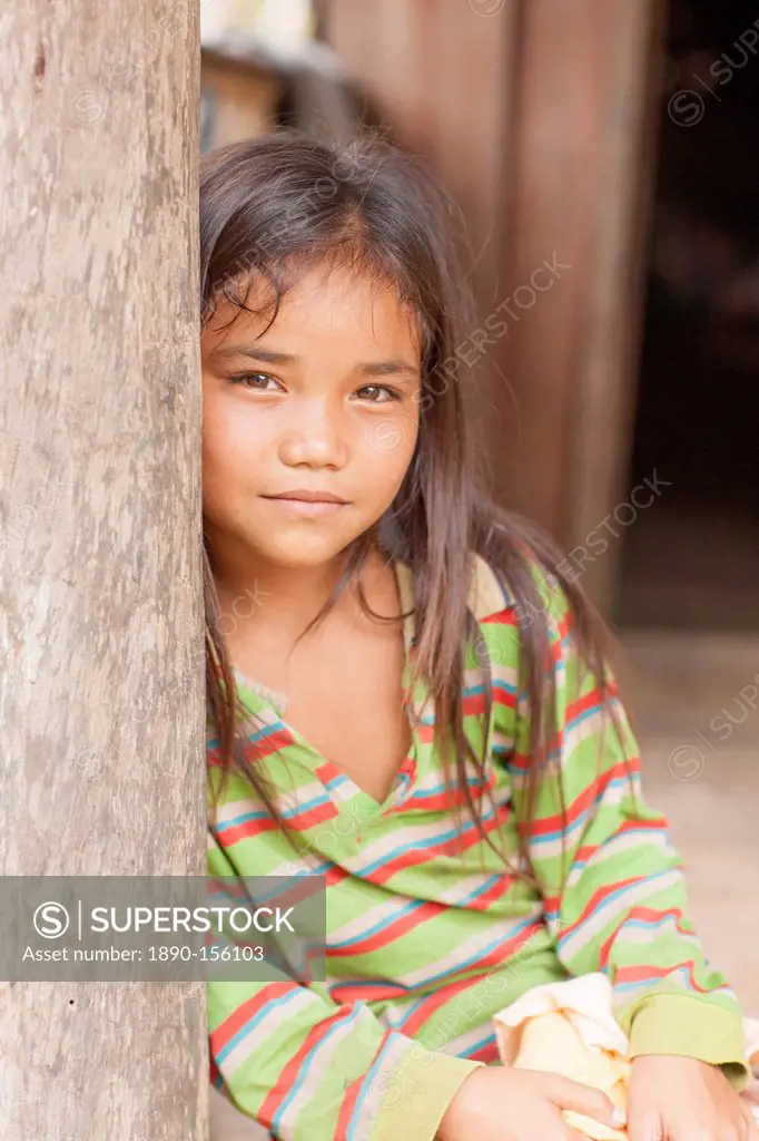 Girl in doorway, Laos, Indochina, Southeast Asia, Asia