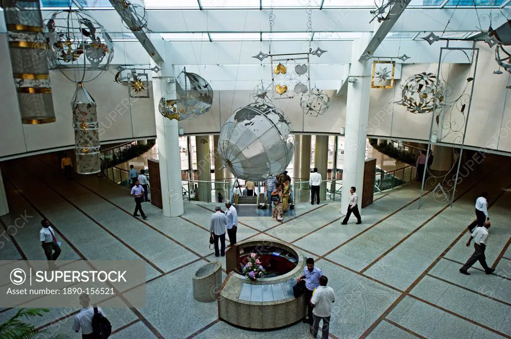 Traders cross the floor in the lobby of the World Trade Center, Colombo, Sri Lanka, Asia