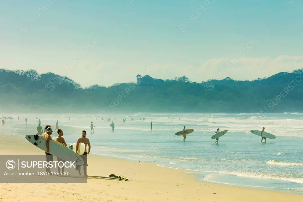 Surfers on Playa Guiones beach, Nosara, Nicoya Peninsula, Guanacaste Province, Costa Rica, Central America