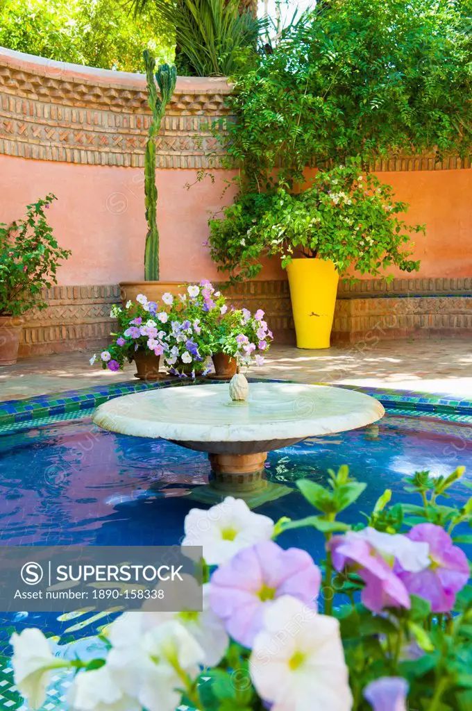 Fountain and flowers in the Majorelle Gardens (Gardens of Yves Saint-Laurent), Marrakech, Morocco, North Africa, Africa