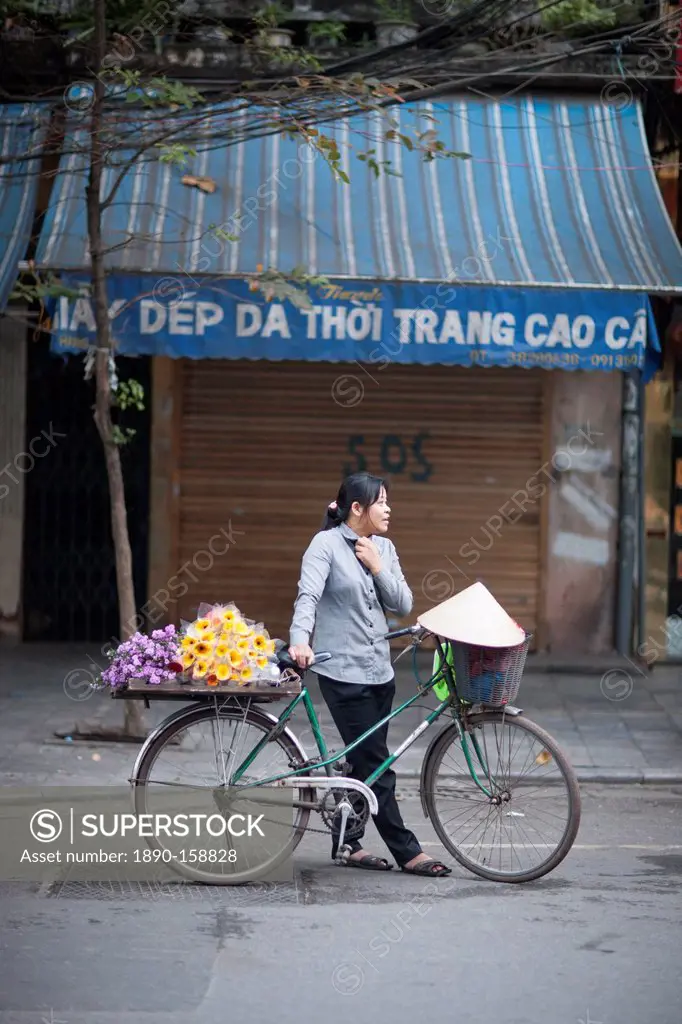 Woman and bicycle, Hanoi, Vietnam, Indochina, Southeast Asia, Asia