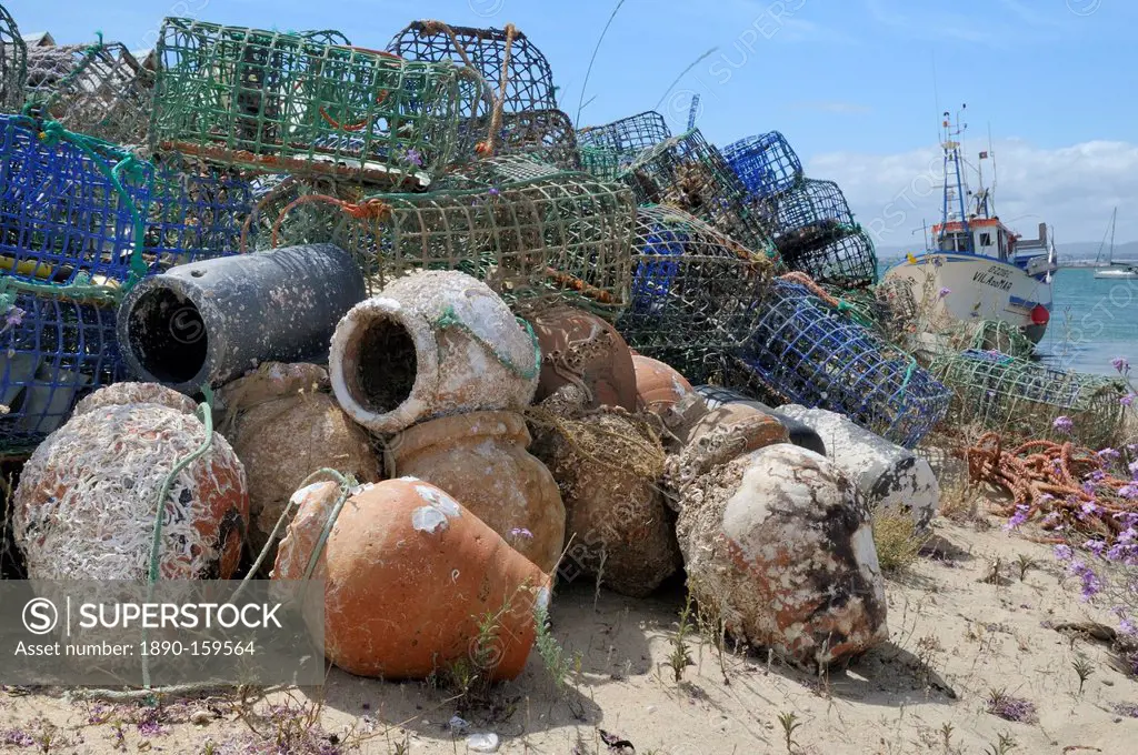 Stack of lobster pots and ceramic octopus pots on Culatra island, Parque Natural da Ria Formosa, near Olhao, Algarve, Portugal, Europe