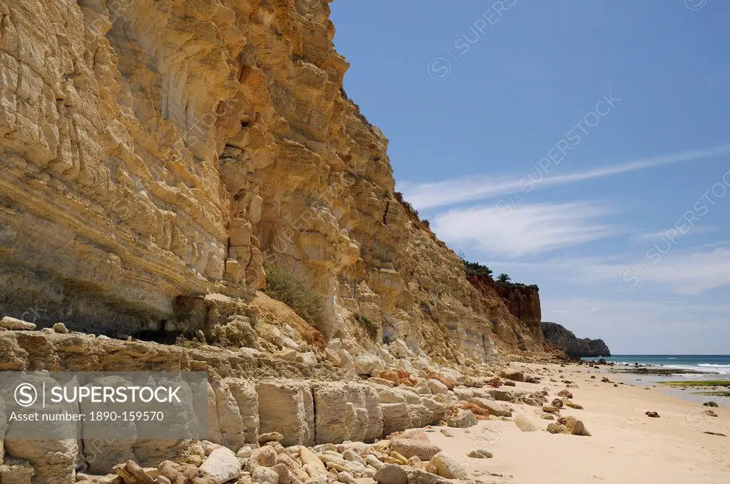 Weathered, layered sandstone cliffs at Praia do Mos, Lagos, Algarve, Portugal, Europe
