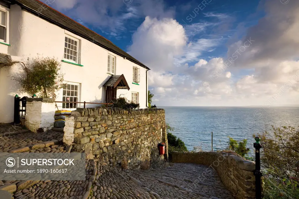 Whitewashed cottage and cobbled lane in the picturesque village of Clovelly, Devon, England, United Kingdom, Europe