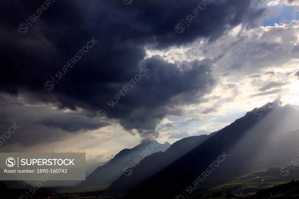 Summer storm clearing over the mountains of the Valais region, Swiss Alps, Switzerland, Europe