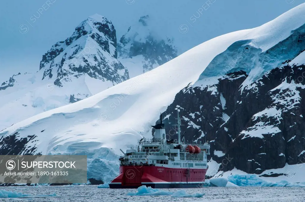 Cruise ship in front of the glaciers and icefields of Danco Island, Antarctica, Polar Regions