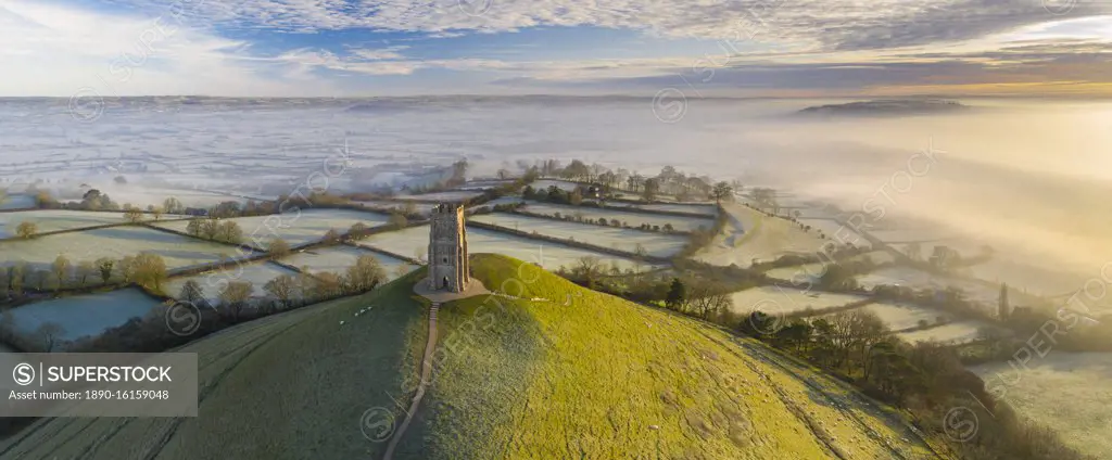 Aerial view by drone of frosty winter morning at Glastonbury Tor, Somerset, England, United Kingdom, Europe