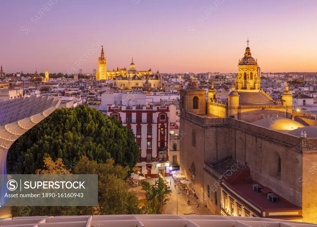 Sunset Seville skyline of Cathedral and city rooftops from the Metropol Parasol, Seville, Andalusia, Spain, Europe