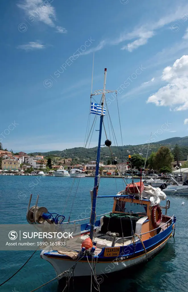A traditional wooden fishing boat in the harbour in Kassiopi on the northeast coast of Corfu, Ionian Islands, Greek Islands, Greece, Europe