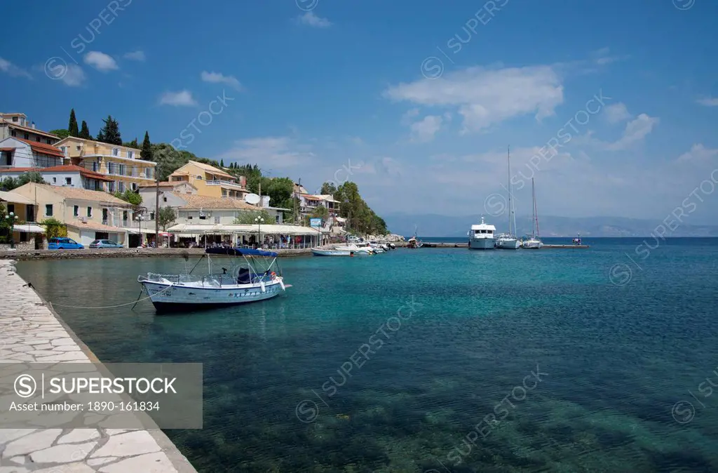 Boats in the harbour in Kassiopi on the northeast coast of Corfu, The Ionian Islands, Greek Islands, Greece, Europe