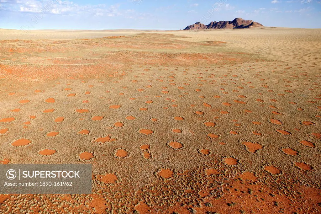 Aerial view from hot air balloon over magnificent desert landscape covered in 'Fairy Circles', Namib Rand game reserve Namib Naukluft Park, Namibia, A...