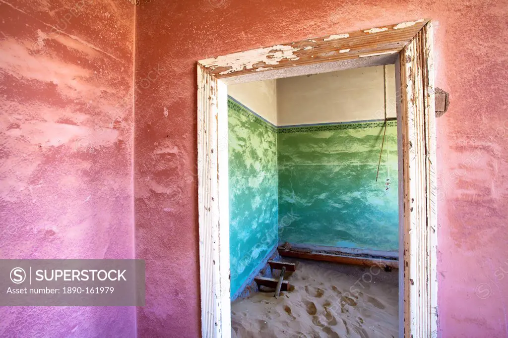 Interior of building slowly being consumed by the sands of the Namib Desert in the abandoned former German diamond mining town of Kolmanskop, Forbidde...