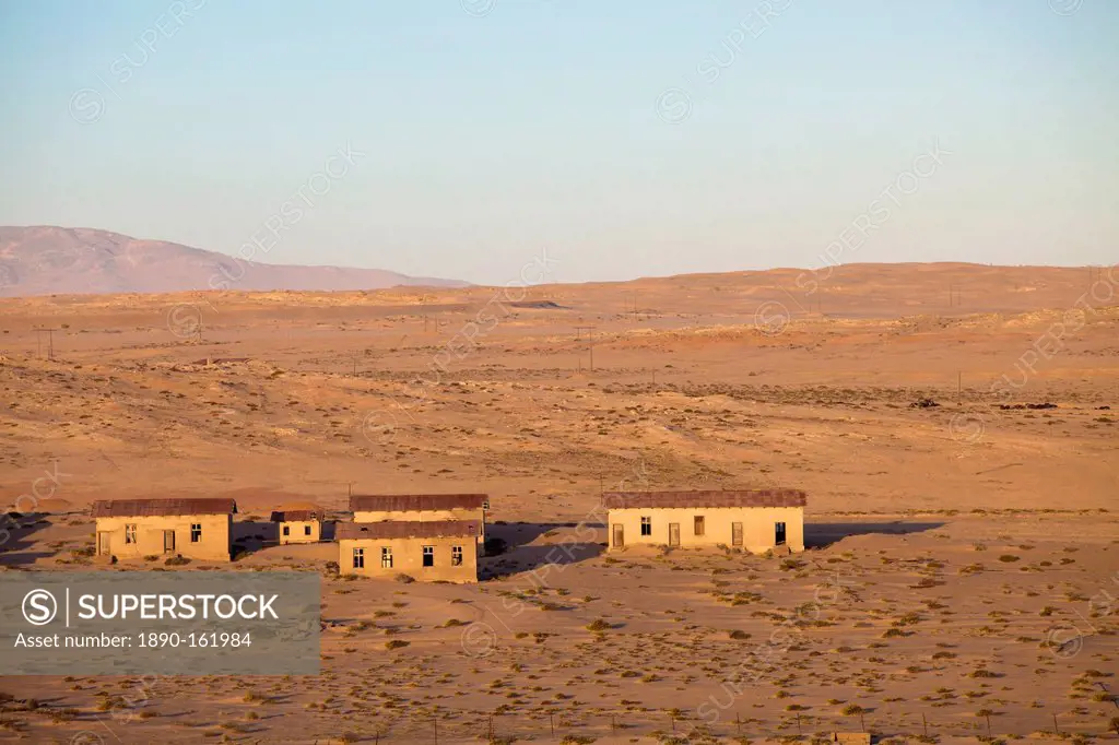 Buildings in the abandoned former German diamond mining town of Kolmanskop on the edge of the Namib Desert, Forbidden Diamond Area near Luderitz, Nami...