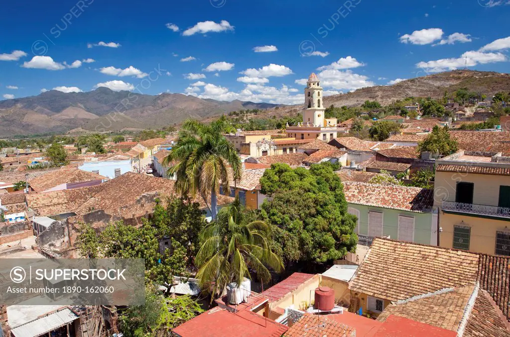 View over pantiled rooftops of the town towards the belltower of The Convento de San Francisco de Asis, Trinidad, UNESCO World Heritage Site, Cuba, We...