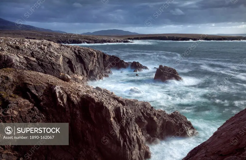 Rugged coastline being pounded by waves on the West coast of Lewis near Mangersta, Isle of Lewis, Outer Hebrides, Scotland, United Kingdom, Europe