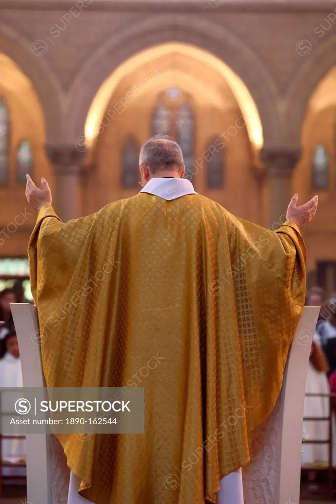 Priest during Eucharist celebration, Paris, France, Europe