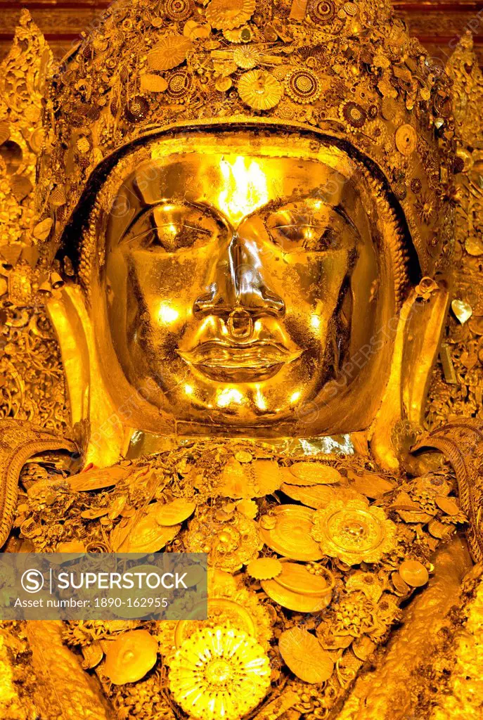 Myanmar's most famous Buddha image, 13ft high and covered in 6 inches of pure gold leaf , Mahamuni Paya, Mandalay, Myanmar (Burma), Southeast Asia
