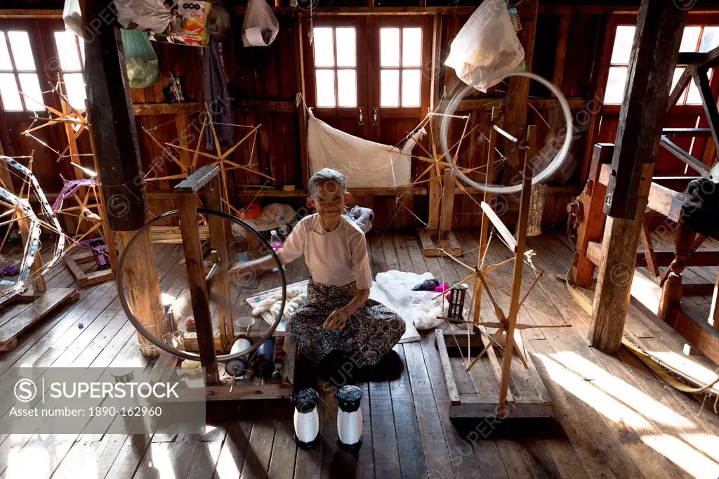 Woman spinning silk in factory in In Phaw Khone village, Inle Lake, Myanmar (Burma), Southeast Asia
