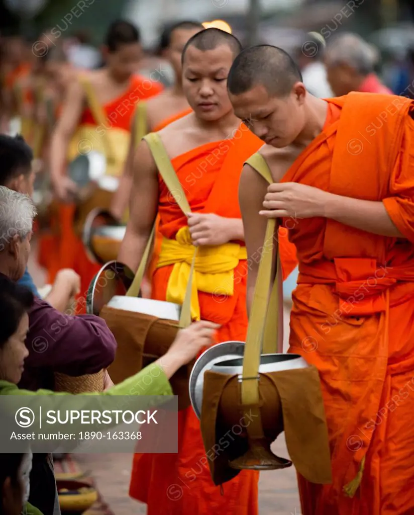 Buddhist Monks during Alms giving ceremony (Tak Bat), Luang Prabang, Laos, Indochina, Southeast Asia, Asia
