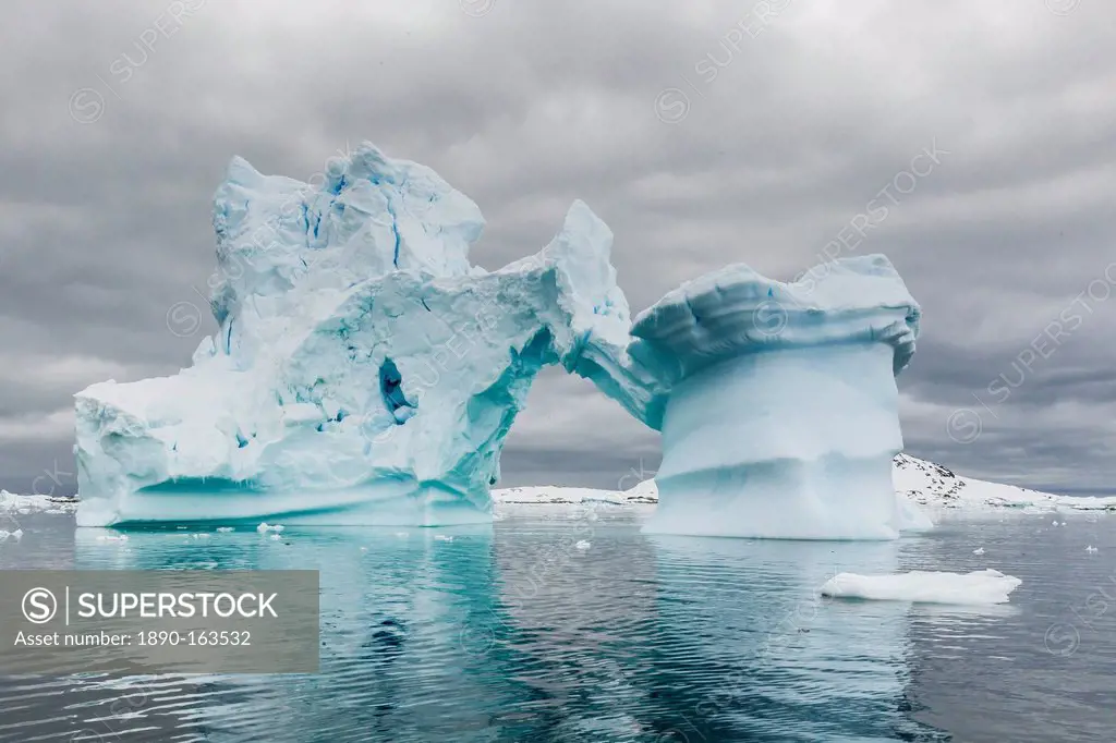 Huge arched iceberg near Petermann Island, western side of the Antarctic Peninsula, Southern Ocean, Polar Regions