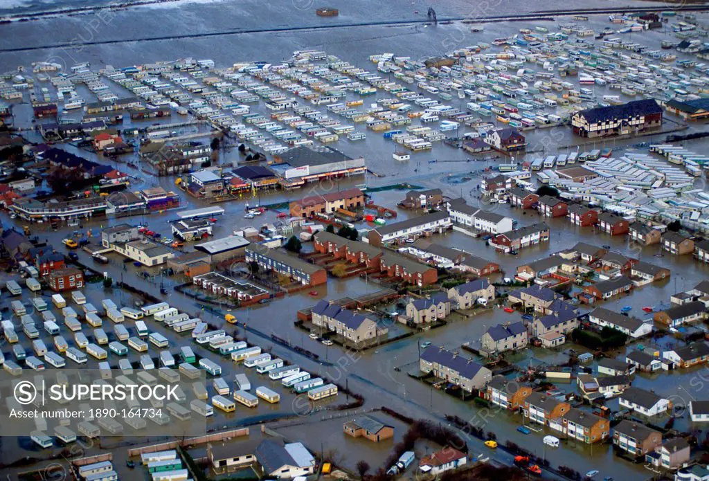 The flooded town of Towyn in North Wales. Caravans in a mobile home park and caught up in the disaster. Streets of houses are surrounded by the flood ...