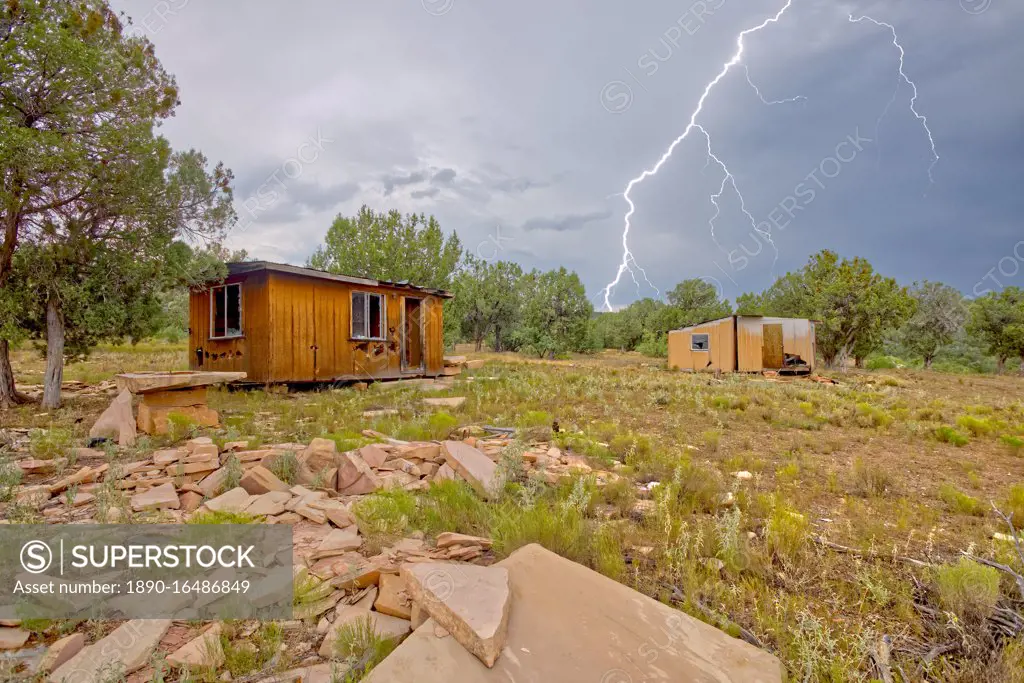 Lightning striking from a monsoon storm building up over the abandoned Mexican Quarry near Perkinsville, Arizona, United States of America, North America