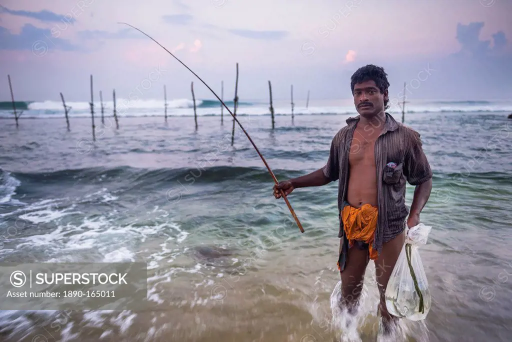 Stilt fisherman at Midigama near Weligama, South Coast, Sri Lanka, Indian Ocean, Asia