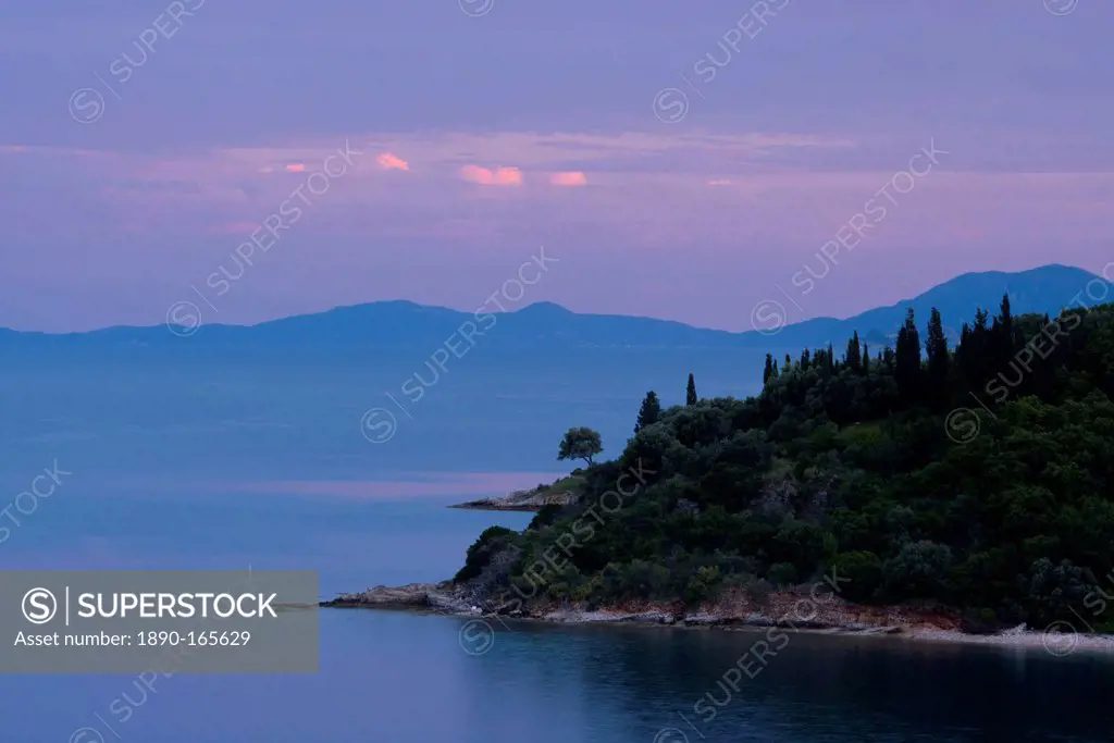 Sunset on the northeast coast of Corfu near Agios Stefanos, Corfu, Ionian Islands, Greek Islands, Greece, Europe