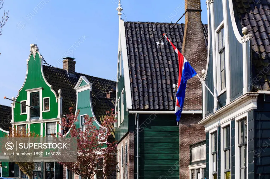 Preserved historic houses in Zaanse Schans, a village on the banks of the River Zaan, near Amsterdam, a tourist attraction and working museum, Zaandam...