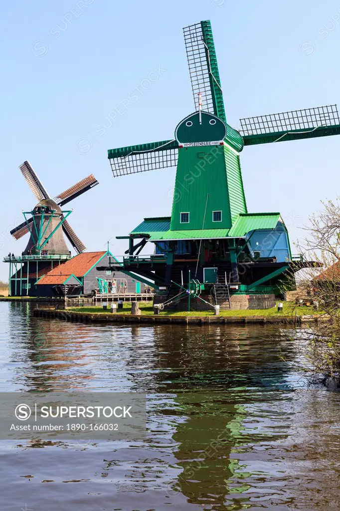 Preserved historic windmills and houses in Zaanse Schans, a village on the banks of the river Zaan, near Amsterdam, it is a popular tourist attraction...