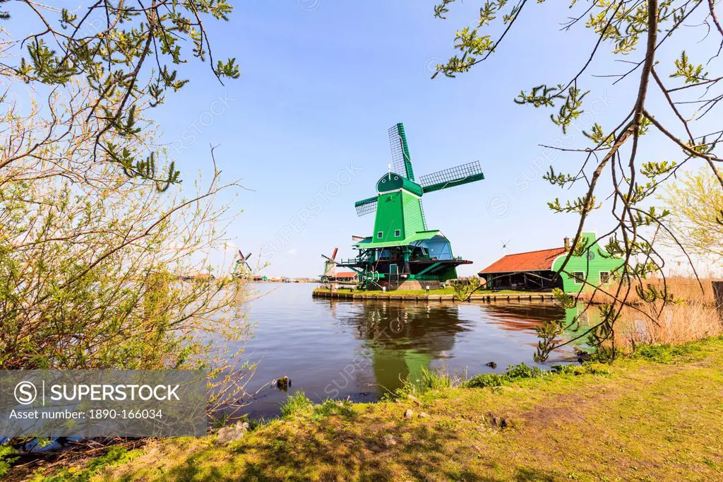 Preserved historic windmills and houses in Zaanse Schans, a village on the banks of the river Zaan, near Amsterdam, it is a popular tourist attraction...