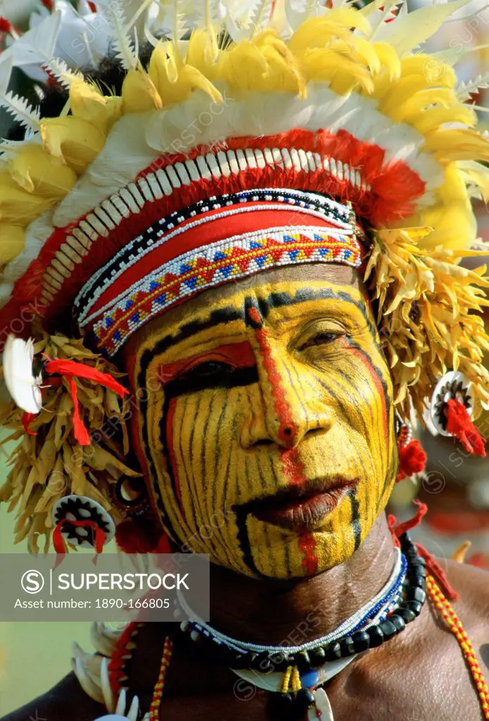 Native man with face paint at a Sing Sing tribal gathering, Papua New Guinea