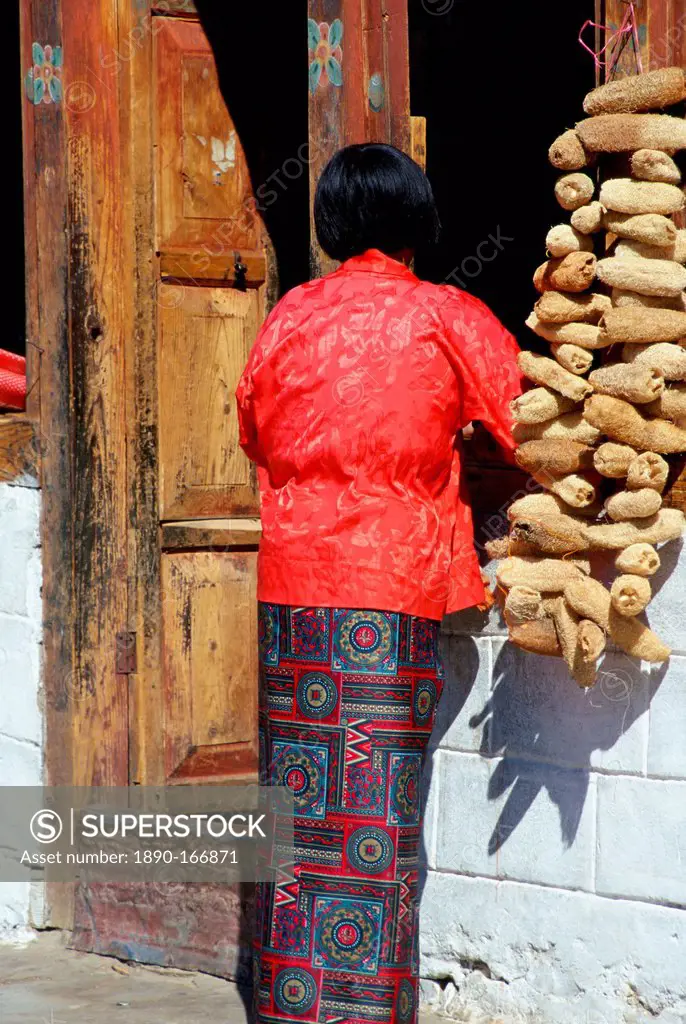 Woman with loofahs, Paro, Bhutan