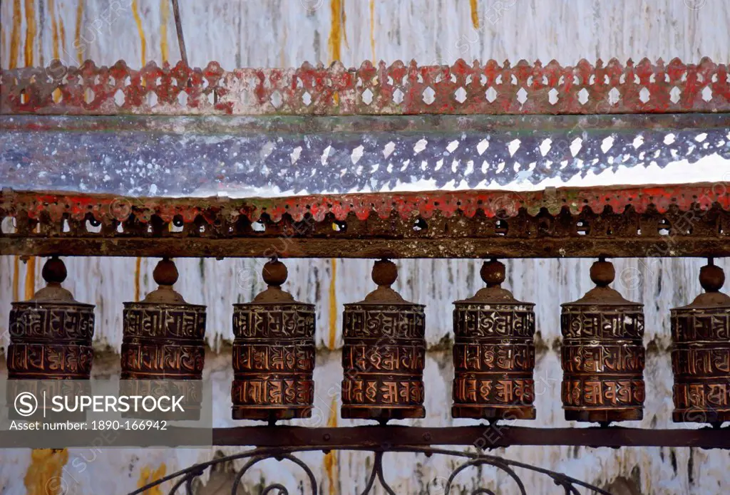 Ornately carved Buddhist prayer wheels at Swayambhunath Stupa Buddhist monument in Nepal.