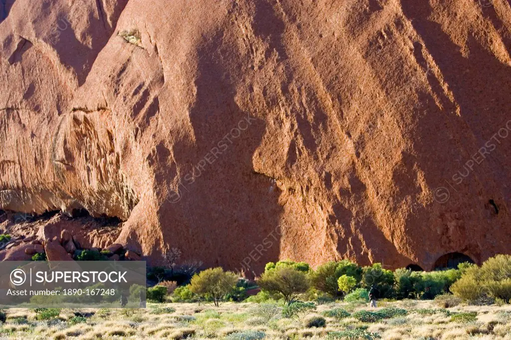 Tourists at the base of Ayers Rock, Uluru, Australia