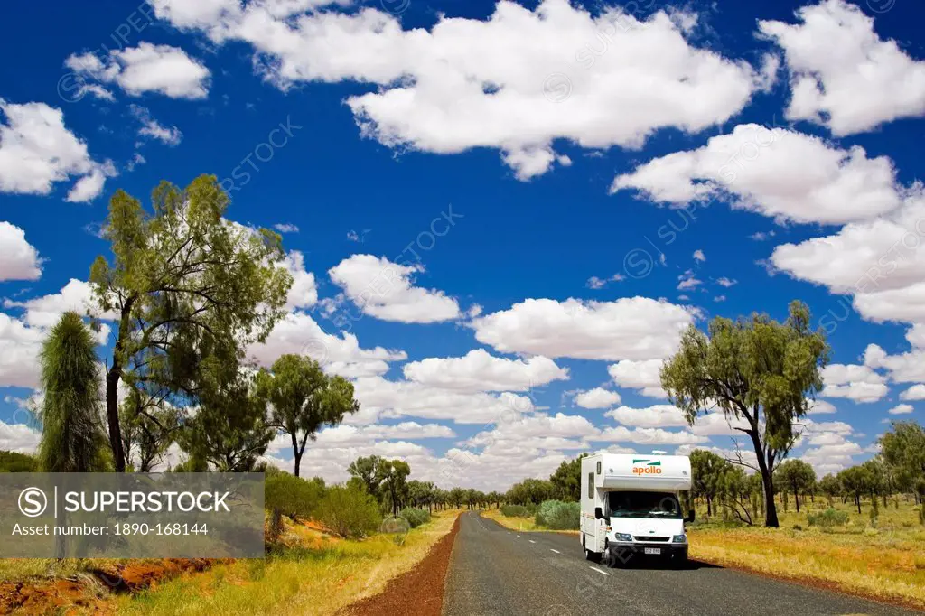 Motorhome travels road in the Red Centre, Northern Territory, Australia