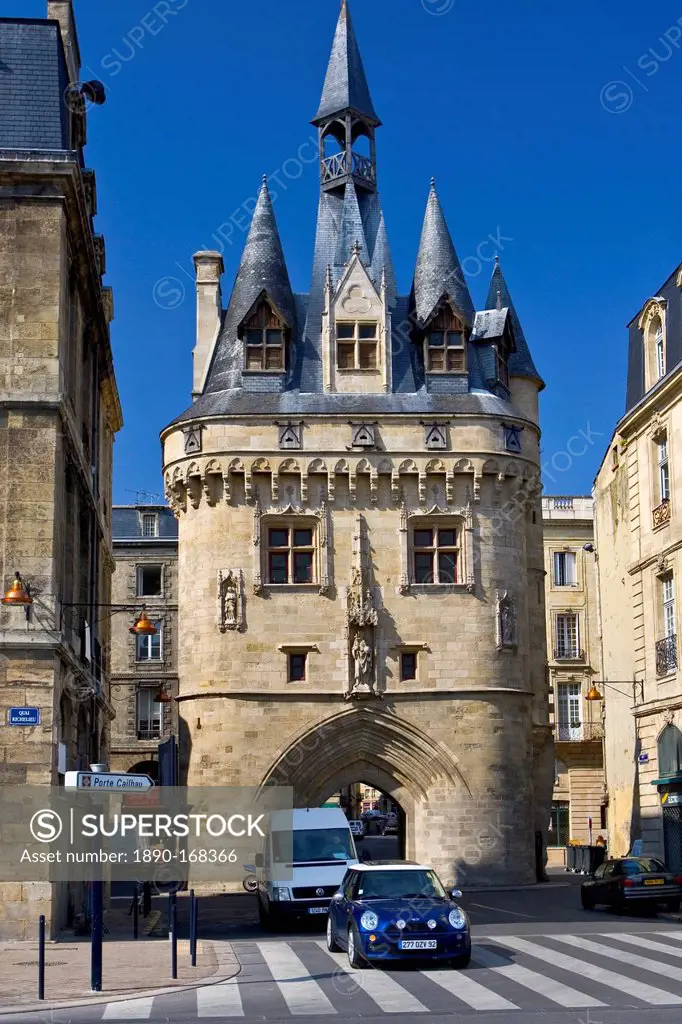 Mini Cooper car at Porte Cailhau 15th century entrance to city of Bordeaux marks victory of Charles VIII at Fornoue