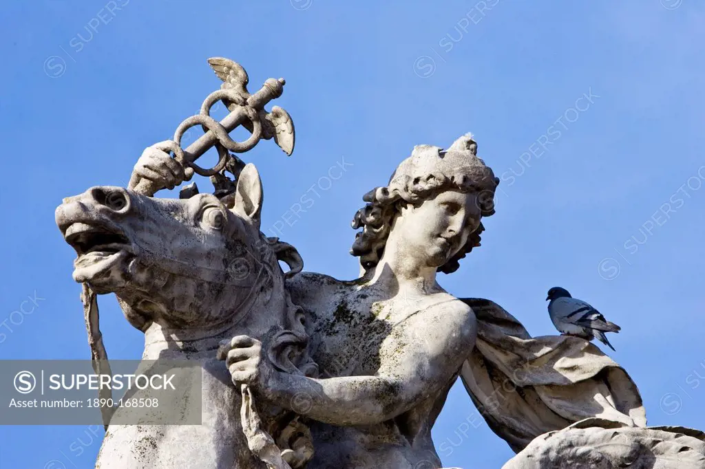 Pigeon rests on horse and rider statue in Place de la Concorde, Paris, France