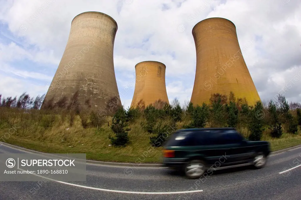 Four wheel drive vehicle passes Rugeley Power Station, Staffordshire, United Kingdom