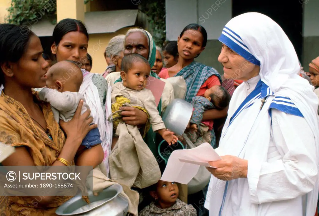 Mother Teresa with mothers and children at her Mission in Calcutta, India