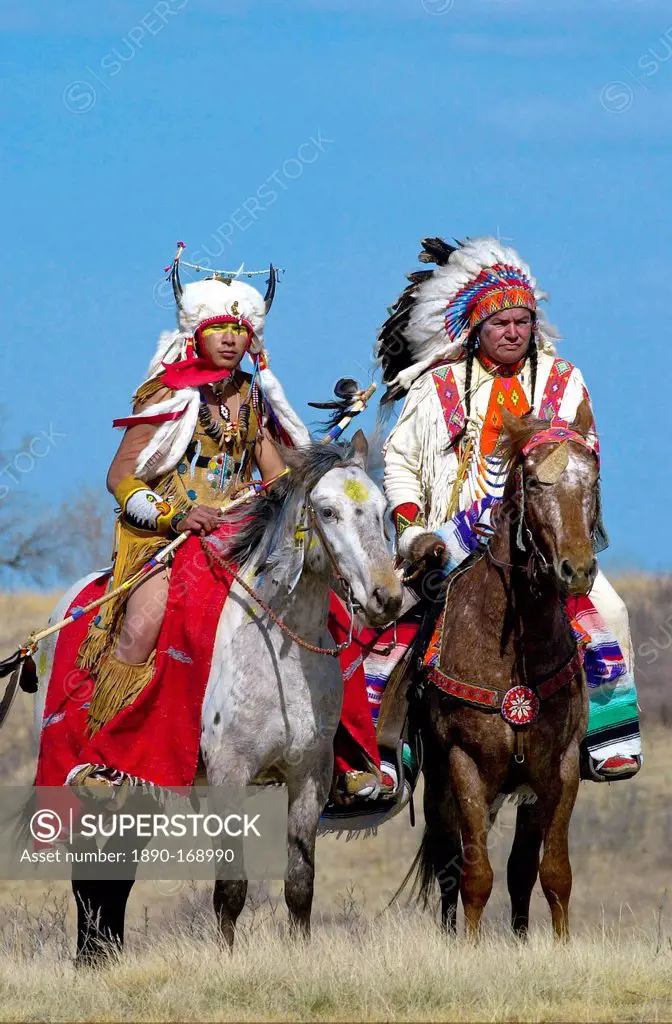 Canadian Plains Indians chiefs on horseback at cultural display at Wanuskewin Heritage Park in Saskatoon, Canada